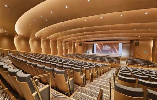 Integrated acoustic wall panels within Plenary